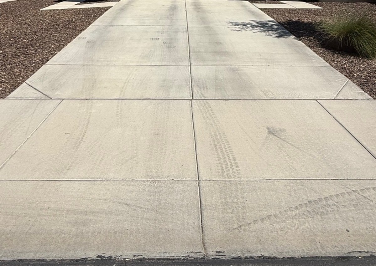Tire-Marked Driveway before power washing